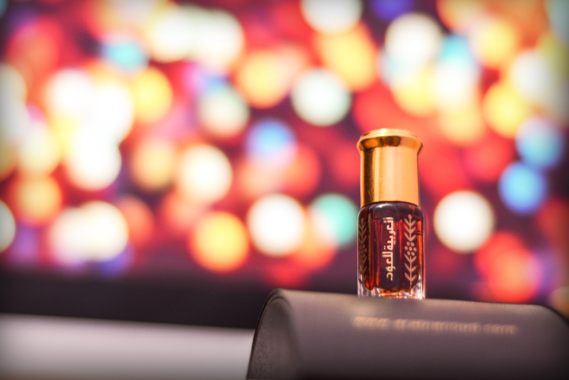 perfume bottle with bokeh lights